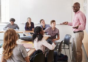 Educator teaching a class of students